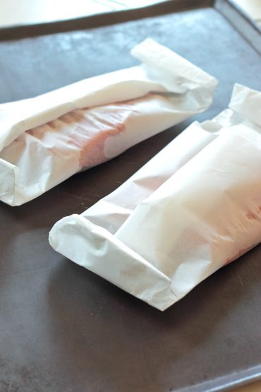 Baking this Asian-inspired salmon in parchment pockets locks in all that amazing flavor!