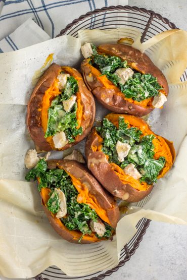 Warm kale caesar salad stuffed into a sweet potato! A healthy, paleo, Whole30 dinner